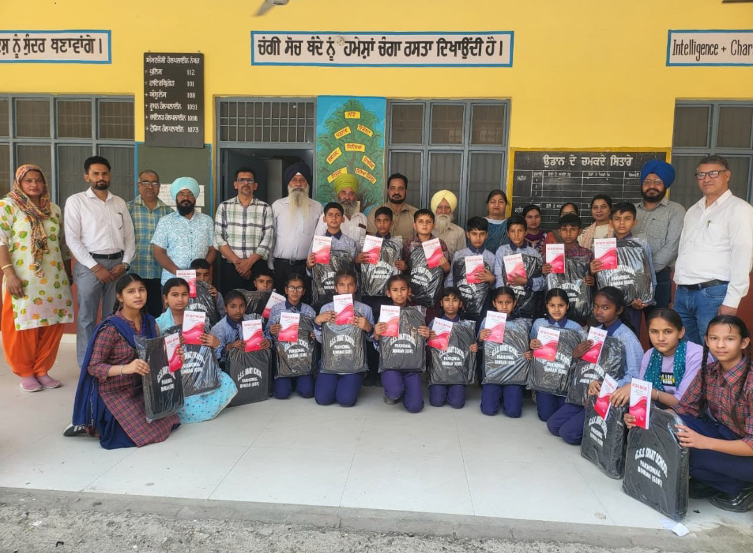 NRIs distributed bags and stationery to school children during a function at Government Senior Secondary School Pakhowal.